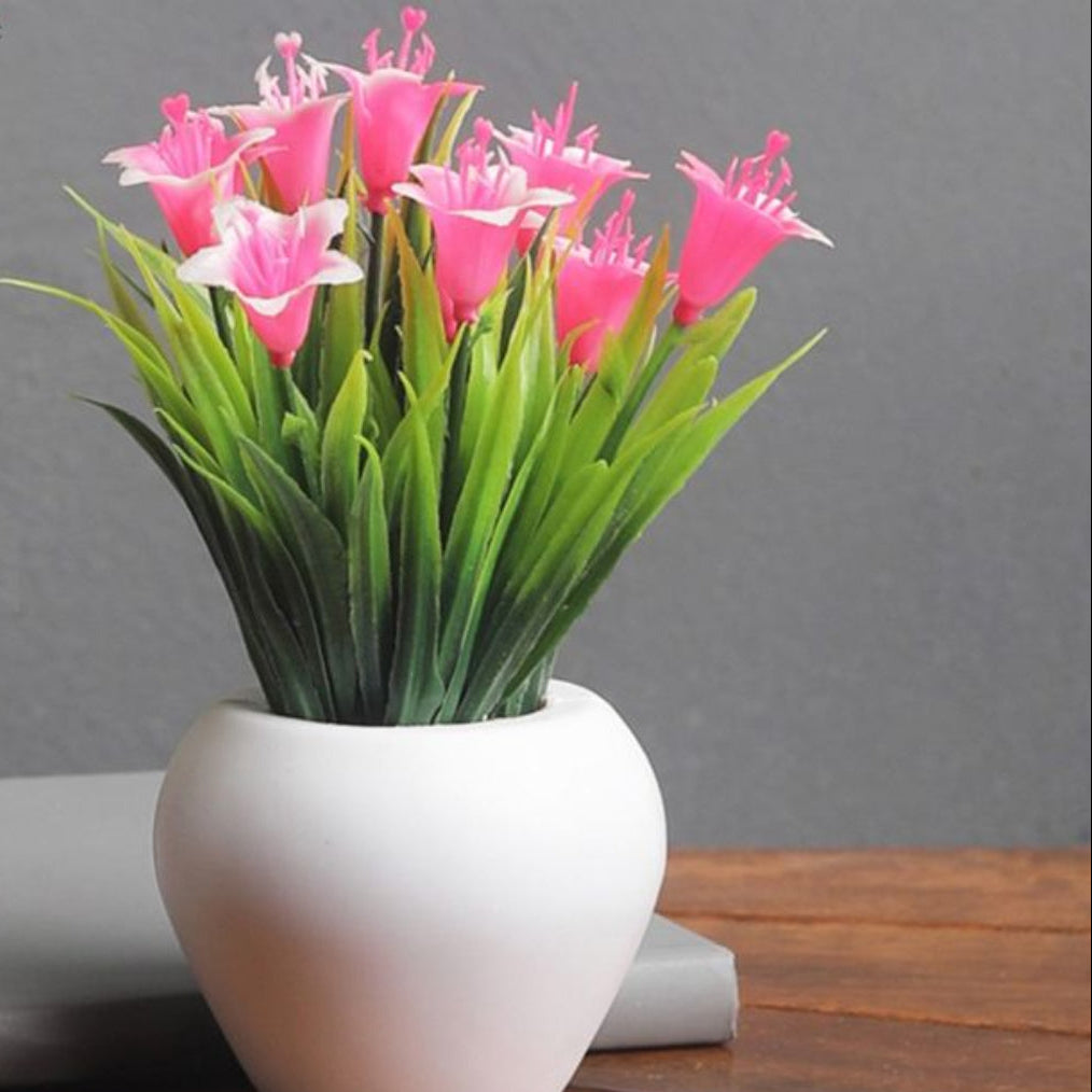 Artificial pink lily plant with realistic Peace Lily flowers for home and office decor