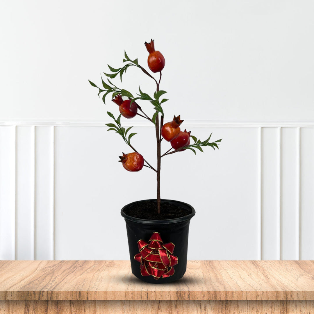 Artificial pomegranate bonsai plant with lush green foliage