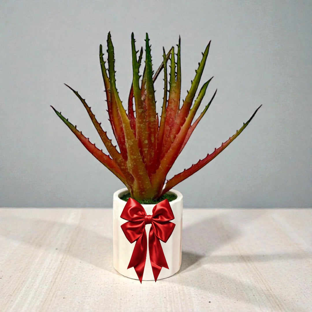 Artificial aloe vera plant in white ceramic pot for home and office