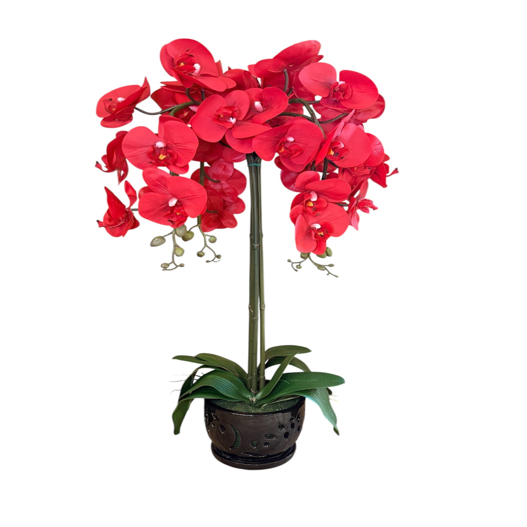 Artificial red orchid in a pot for elegant floral styling