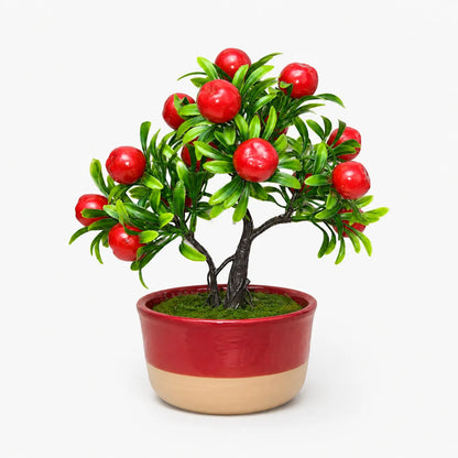 Artificial mini apple bonsai in a red and beige ceramic planter.